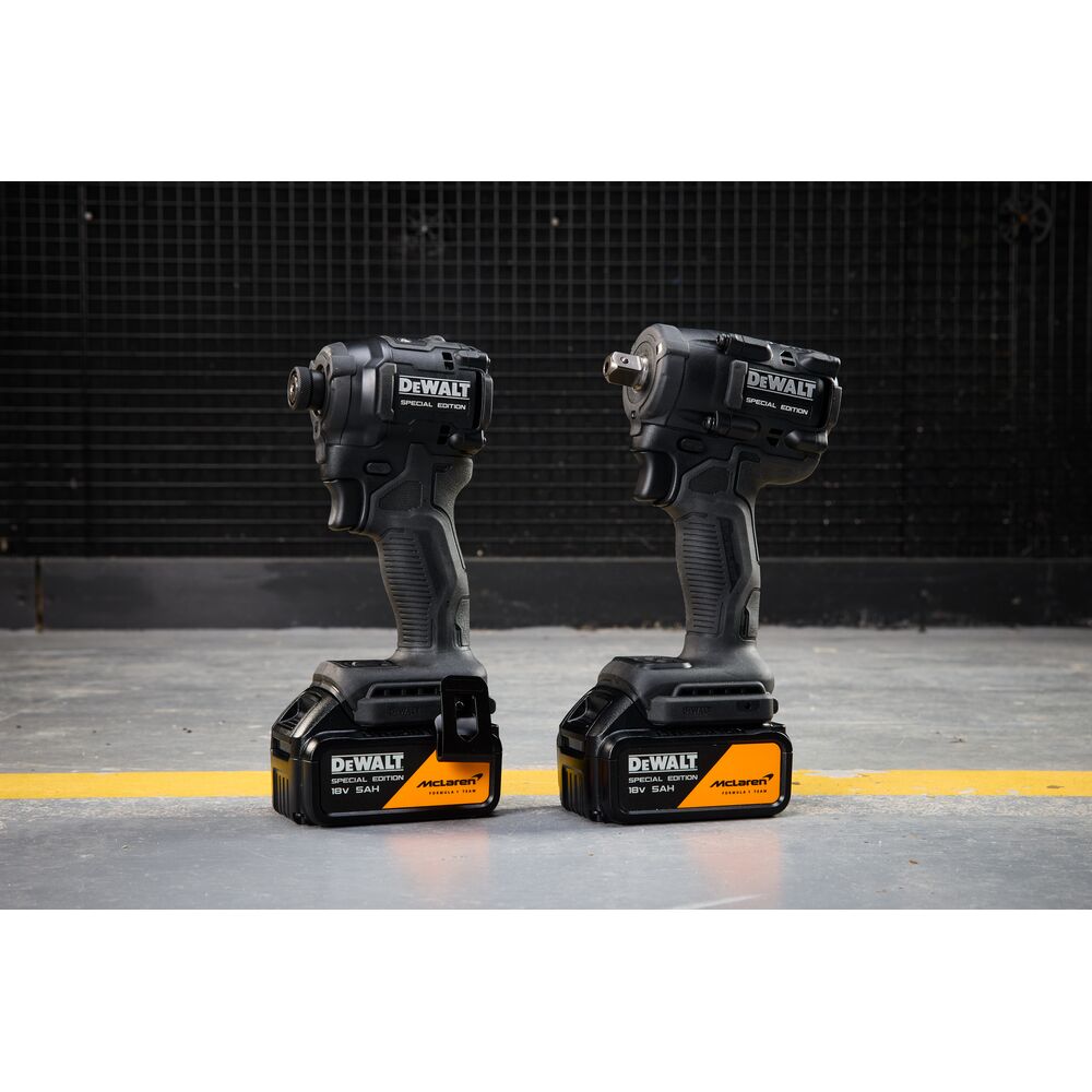 DEWALT DCK2224MP2T-QW, DCK2224MP2T cordless tools, two black and yellow special edition units on floor.
