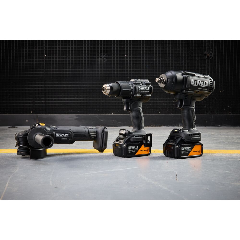DEWALT tools DCK3222MP2T-QW and DCK3222MP2T set shown on floor, includes drill, grinder, and impact driver.